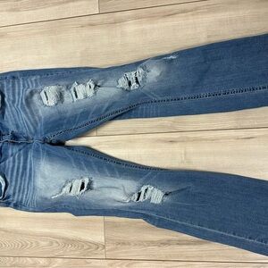 Buckle Boot Cut Jeans in Distressed Blue